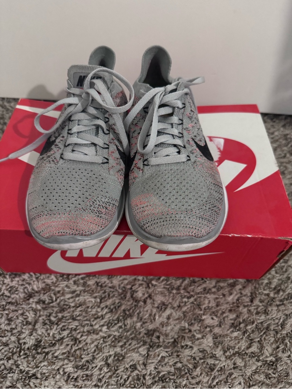 Nike Women's Light Gray Flyknit Running Shoes with Pink Accents
